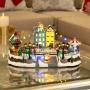 VILLA NAVIDEÑA CON PATINADERO DE PLÁSTICO ILUMINADA CON MOVIMIENTO 41 CM